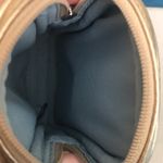 Coach gold wristlet/accessory holder Photo 4