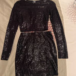 Windsor Stunning black sequin set featuring a long sleeve crop top and matching skirt. Perfect for a night out. Photo 0