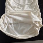 Women size S small One shoulder ivory top with black bow and crystals Photo 3