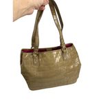 Gold/Tan embossed
Faux leather shoulder
Handbag Gold Photo 2