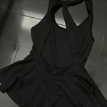 Sparkle & Fade Black Peplum Top With Cutout Back Photo 2