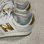 New Balance  Women's Cream and Gold Athletic Shoes Photo 3