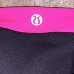 Lululemon  Roll Down Flare Crops athletic yoga workout pants black pink Photo 4