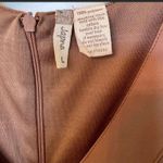 Japna - Super cute brown dress with ruffled shoulder detail! 🤎 Photo 2