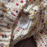 Main Strip  oversize sweater.  Off the shoulder.  Size Small. Twist back. Photo 3