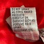 Sherri Hill short red dress with cutouts and a sheer neckline Photo 10