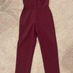 Adelyn Rae Red Crepe Twisted Off-Shoulder neckline Straight Leg Jumpsuit Photo 3