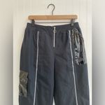 Nike  Sportwear Icon Clash Pants in Black Zippered Leg Pocket Detail Size M Photo 6