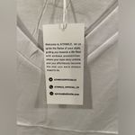 Amazon White V-Neck Shirt Photo 4