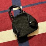 Fubu black monogram hand bag the collection
printed Photo 0