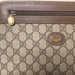 Gucci GG Supreme Clutch with Gold GG Zipper Pulls On Top Close and Front Pocket Photo 1