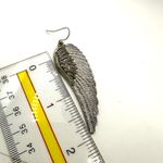 Silver tone angel wing earrings Photo 5