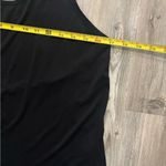  black and white  tank top. Features white Nike logo and straps. Photo 5