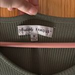 Absolutely Famous Women's Green Top with Floral Sleeves Photo 1