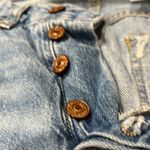 Really ripped jeans! Lol. Both legs ripped up but stylish. Blue Size 2 Photo 3