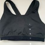 Nike Women's Black Sports Bra Sleek black design with white logo. . Photo 4