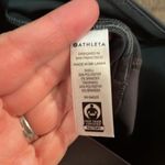 Athleta Ace Black Tennis Skort with silver reflective stripe on waistband Photo 6