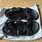 Charles and Keith Black Sandals with Gold Accents Photo 1