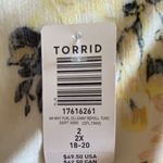 Torrid NWT- Stunning white with bright colorful flowers, babydoll style, ties in front, flutter sleeves, lightweight, the perfect summer top, brand new, size 2x Measurements: Bust: armpit to armpit 25 inches Waist: side to side 22-27 inches Length: shoulder seam to bottom 30 inches Photo 7
