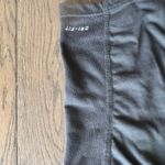 Nike Dri-Fit short sleeve tennis top. Black and yellow. Size small. Photo 4