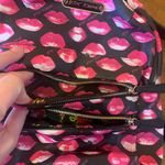 Betsey Johnson Betsy Johnson small backpack black with pink lips pattern several pockets sling Photo 3