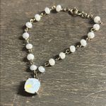 This is a moonstone beaded bracelet with a cushion Photo 0