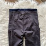 Athleta  Ultimate Stash Pocket 7/8 Tight leggings in a grey/mauve color XXS Photo 7