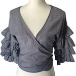 Haute Monde Ruffle Wrap Blouse — Bold Sleeves, Luxe Texture. Photo 0