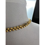 Gold beaded necklace with golden eyelet Photo 2