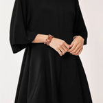 Davi & Dani Davi‎ & Dani Solid Draped Sleeve Ties Back Skort Romper Photo 0