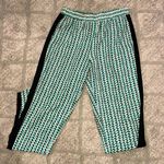 BCBGMAXAZRIA 2 pocket pant in sea green and coral print with black side stripe Photo 0