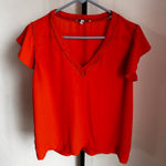 Q&A  orange top size medium Photo 0