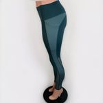 Senita Athletics green leggings size Small mesh details with pockets Photo 2