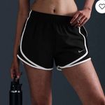 Nike | Tempo Dri-FIT Women's Athletic Performance Mid-Rise Running Shorts Photo 0