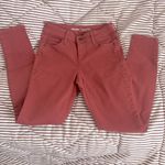 Old Navy Rockstar mid rise jeans in rust Photo 0