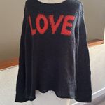 Wooden Ships  Charcoal blue Knit sweater with orange colored letters reading Love Photo 0