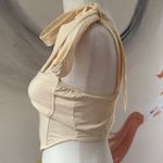 Cider  bandeau.  Size Small. Zip closure on side. Straps tie into bows. Photo 1