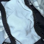 Gaviota diamante black skirted one piece with white flowers! Size undefined Photo 4