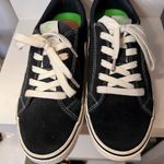 Cariuma Black Canvas Sneakers‎ with White Stripe Detail & Green Inner Sole Photo 1