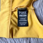 PINK - Victoria's Secret PINK Victoria’s Secret | Ultimate Scoop Gold Glow Yellow Sports Bra Photo 6