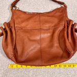 Hobo International HOBO Women's Leather Shoulder Bag with Tassel Accents Zip-Top Closure Photo 11