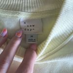 A New Day  pastel yellow pullover mock neck sweatshirt Photo 1