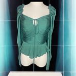House of Harlow 1960 M
Emerald Green Ruched Peplum Top
Long Sleeve Photo 2