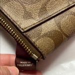 Coach  Brown Clutch with Monogram Pattern and Zipper Closure Photo 7