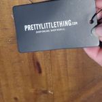 Pretty Little Thing Red and Black Animal Print Bodysuit Photo 1