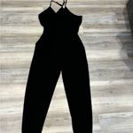 Black Jumper Size Large, adjustable straps and waist out to pit 20, inseam 28 Photo 1