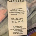 Free People Keeping On Medium floral Twisted Front Hem Knit Top dolman sleeve Photo 6