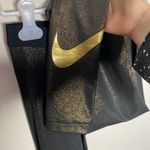Nike  Pro shimmering metallic gold workout leggings size S Photo 3