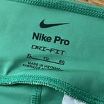Nike  Pro Mid-Rise 7/8 Training Leggings XL Green NEW Workout Gym Running Train Photo 5