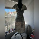 ZARA The dress in the image is a wrap style, with a geometric print of green circles Photo 2